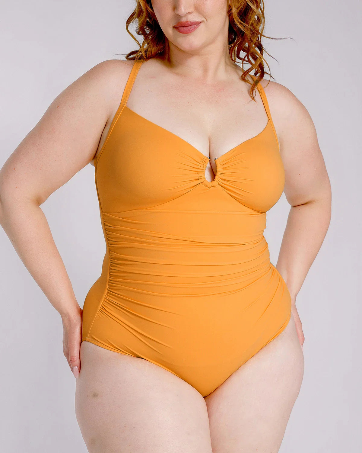 U-ring cutout shaping swimsuit shown on model